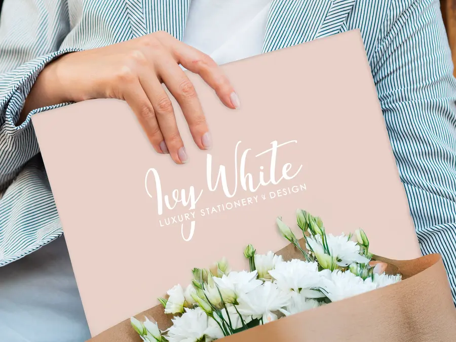 Ivy-WHite-brochure-cover---close-up-blank-magazine-held-by-woman-ezgif.com-resize